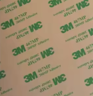 Back of the TapStay plaque showing the 3M adhesive backing